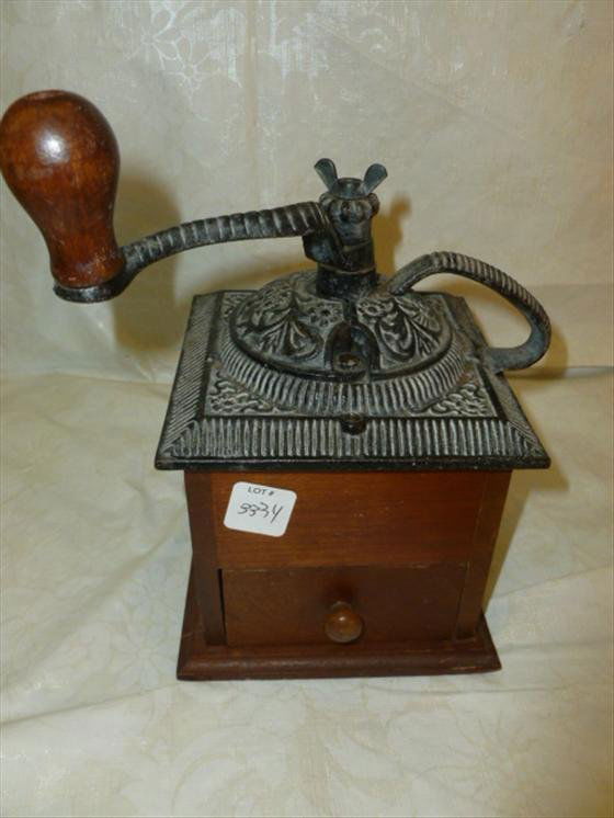 Vintage coffee grinder with wood draw