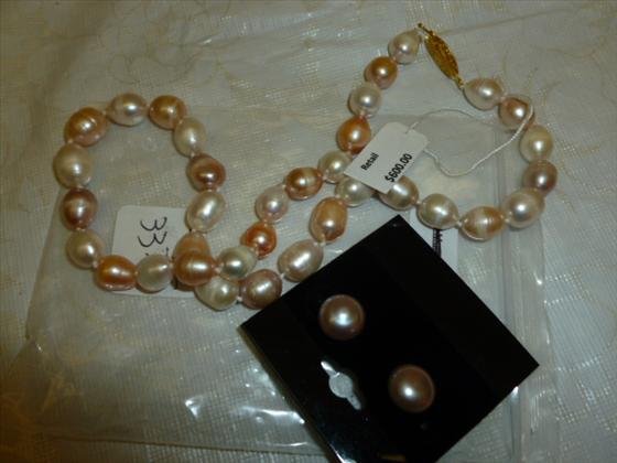 Fresh water pearls necklace and earring set: Fresh water pearls necklace and earring set- hand knotted 9-10 MM 16" long with pierced earrings pink and white in color