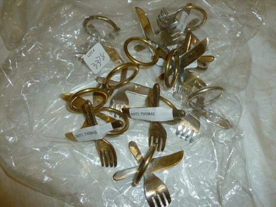 Set of 12 napkin rings: Set of 12 napkin rings- in brass- knife and fork design