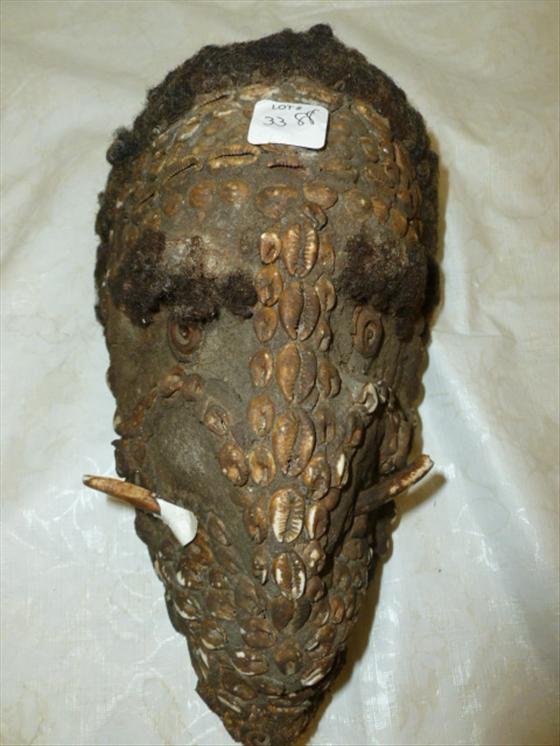 PNG Munduguma Tribe spirit mask With Human Hair: PNG Munduguma Tribe spirit mask With Human Hair- Carved Coconut shell-kept in men's house darkened by smoke- needs piece reglued-12"