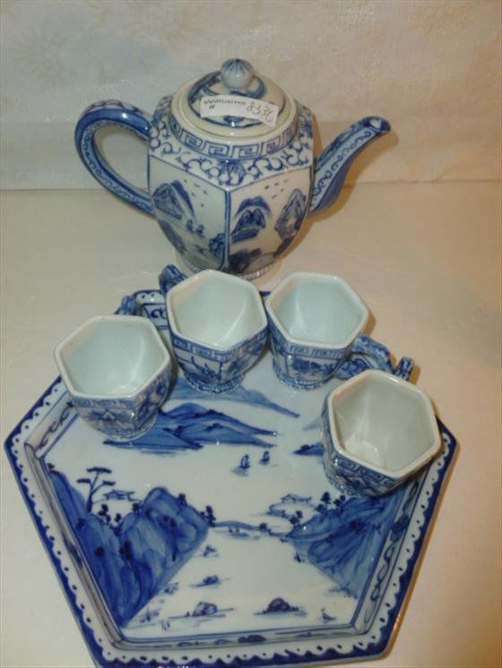 6 pc porcelain tea set blue and white oriental design: 6 pc porcelain tea set blue and white oriental design markings on bottom in script- pot cups and tray