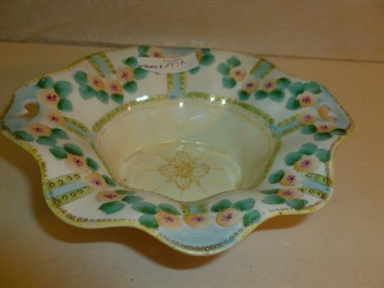 Hand painted porcelain Nippon footed oval shaped bowl: Hand painted porcelain Nippon footed oval shaped bowl scalloped top bead trim with colored flower- marked in green-3 by 8