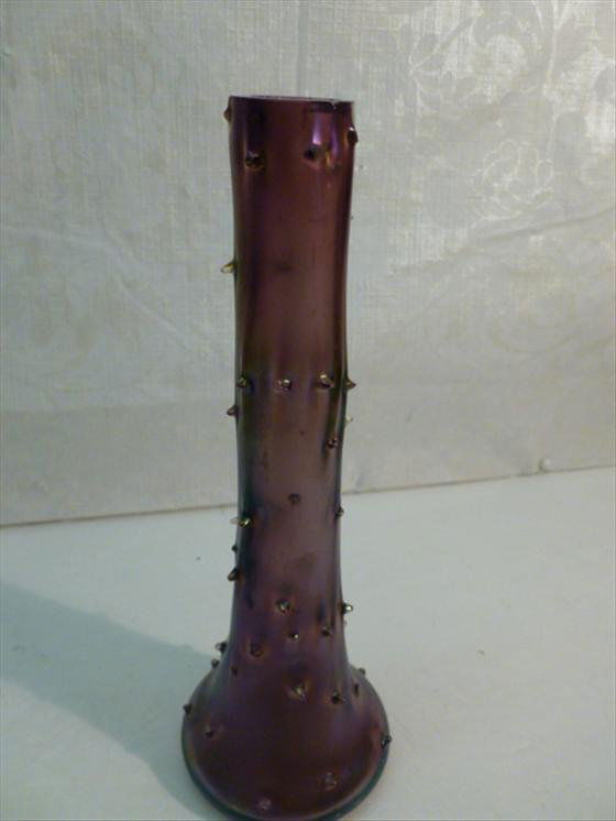 Carnival art glass style bud vase: Carnival art glass style bud vase in iridized purple with protruding nubs 8 1/2 tall- few small dings in the top rim-nice looking piece
