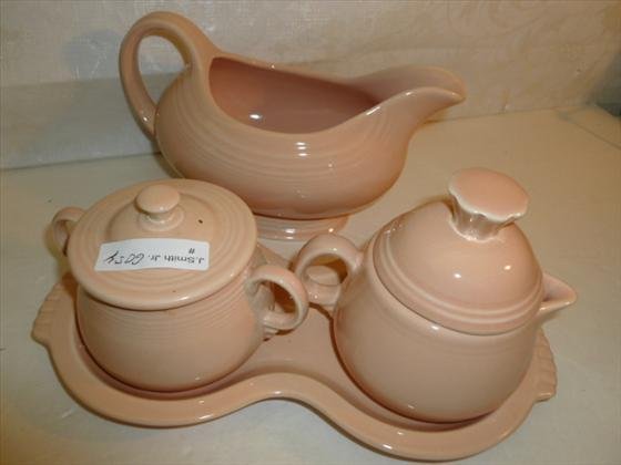 4 pc Fiesta ware creamer sugar tray and gravy: 4 pc Fiesta ware creamer sugar tray and gravy- pale pink in color -good condition-impressed mark