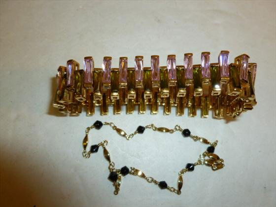 2 pc - bracelet 1.54 troy oz. and necklace .12 troy oz: 2 pc gold over sterling silver bracelet with pink and green cz's 1.54 troy ounce and gold over sterling necklace with saphires.12 troy oz.