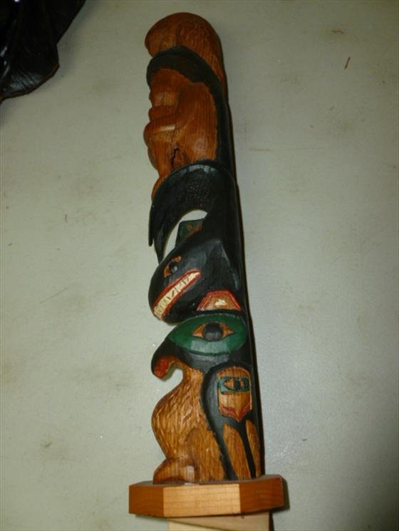 Wood carved statue of man and animals totem pole style: Wood carved statue of man and animals totem pole style-Made in Alaska Black Diamond Co-Love of the sea woman- signed-16 1/2" w/paper