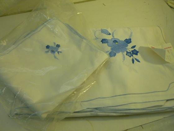 13 pc set- hand made table cloth and napkins: 13 pc set- hand made table cloth and napkins blue and white flowers blue trim- 72 by 144-Handarbeit- like new condition