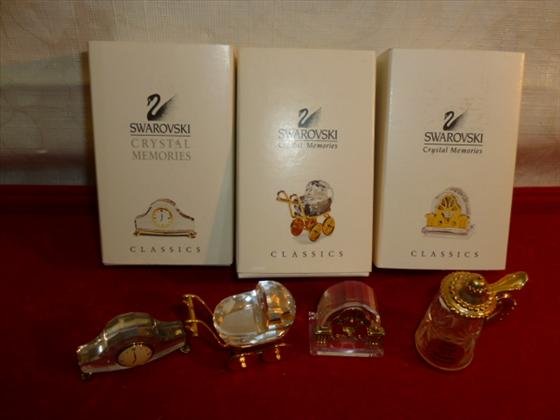 4 pc Swarovski and West Germany crystal mini pieces wit: 4 pc Swarovski and West Germany crystal mini pieces with gold trim- Stein baby carriage mantel clock and antique radio all great shape-3 boxes
