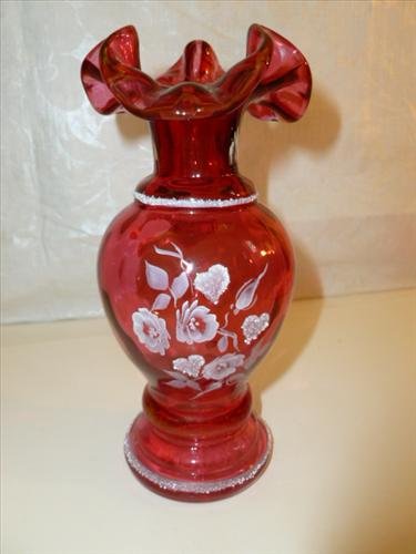 Hand painted and signed cranberry glass ruffled top: Hand painted and signed cranberry glass ruffled top vase- embossed white flower design- by Linda Fleming- 6 1/2" -nice