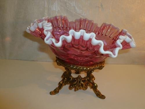 Cranberry with white trim glass ruffled top brides bowl: Cranberry with white trim glass ruffled top brides bowl style on footed brass base-7 1/2 tall-10" diam.