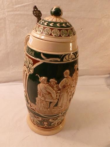 German stein-Marked Germany 900-7- green brown and tan: German stein-Marked Germany 900-7- green brown and tan- 13" tall -men-women sitting by table rifles and house-all the time sooner later