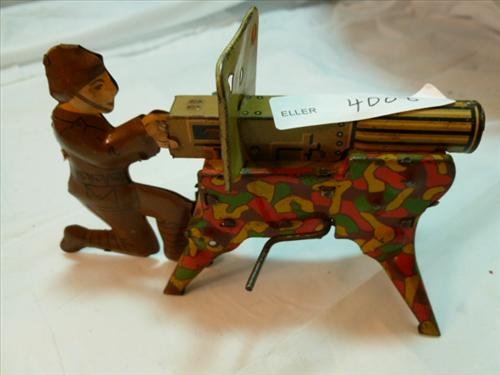Wind up tin- Litho Army man with machine gun on stand-: Wind up tin- Litho Army man with machine gun on stand- 5" long-no names or makes-