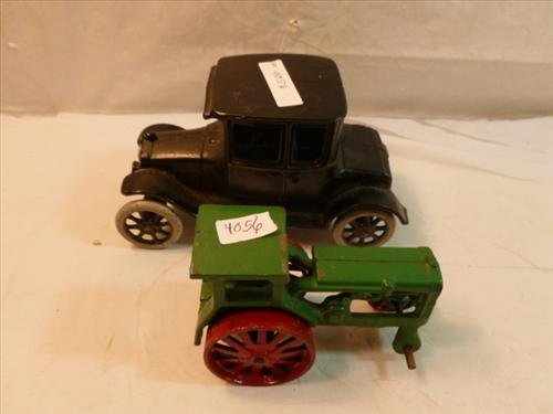 2 piece cast iron tractor missing front wheel and model: 2 piece cast iron tractor missing front wheel and model ford- no names- or marks- 4 1/2 by 6 1/4 long