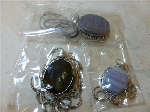 3 Pendants with colored stones and chains- some marked: 3 Pendants with colored stones and chains- some marked 925 some not- all new in bags