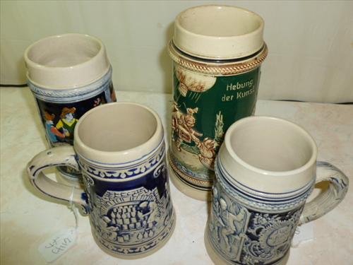 4 stein mugs- West Germany-Venezuela-cobalt blue and: 4 stein mugs- West Germany-Venezuela-cobalt blue and green with different scenes- 6-8 1/2 tall- chip on rim on green piece