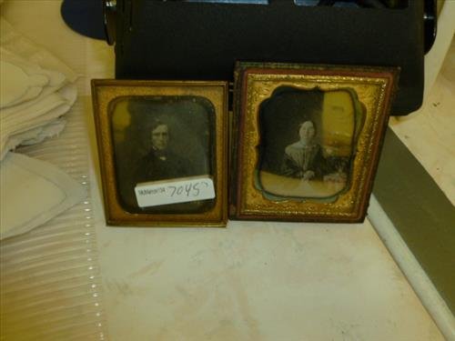 2 Daguerreotypes- lady with colored flowers sitting: 2 Daguerreotypes- lady with colored flowers sitting half case-3 3/4"- other man- 3 1/4- metal framed no case