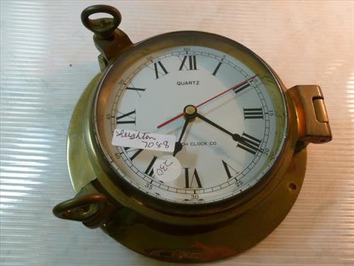 Brass Quartz Harwich porthole style wall clock: Brass Quartz Harwich porthole style wall clock with roman numerals glass front-8 1/2 diam.. Nice looking piece