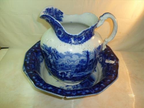 Flow blue basin 13 3/4"and pitcher 11"oriental design: Flow blue basin 13 3/4"and pitcher 11"oriental design- Ridgewood England- chips in bowl pitcher is good-buy as is