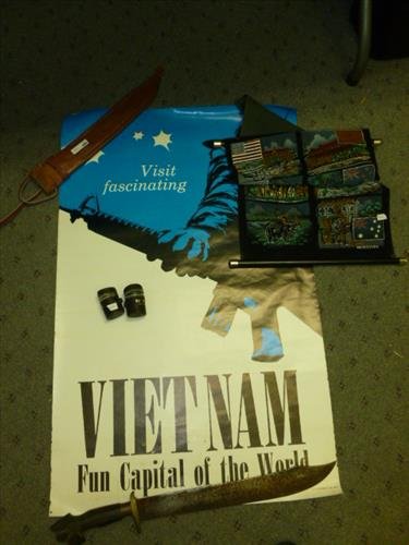 Lot of misc. items from Viet Nam era and the: Lot of misc. items from Viet Nam era and the Philippines'-Poster wall hanging 2 empty film cases -Machete in sheath marked Philippines