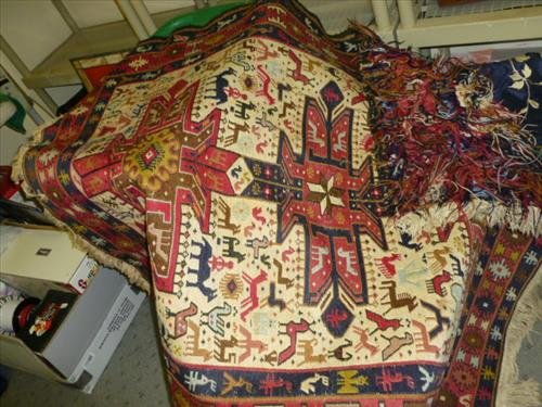 Indian rug- hand tied and knotted no backing- nice: Indian rug- hand tied and knotted no backing- nice designs of animals -43 1/2 by 56- not including fringe- nice colors