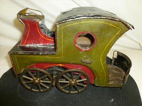 1920's friction pressed steel wood sides and iron train: 1920's friction pressed steel wood sides and iron train engine- green red and black- original paint- 7 1/2 by 10 1/2- 4 wheels-niece piece