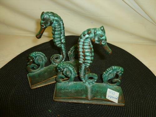 Pair solid bronze sea horse book ends- 1940's by: Pair solid bronze sea horse book ends- 1940's by Virginia Metal craft- marked- Made in USA-5 1/2"- 3 sea horses on top of open book- real nice