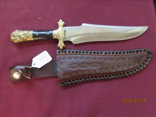 Chipaway Cutlery Pakistan Knife - in Leather Sheath: Chipaway Cutlery made Pakistan Surgical Steel Knife - Handle is Gold Tone with Bakelite Look - Blade is 7" long in Leather Sheath