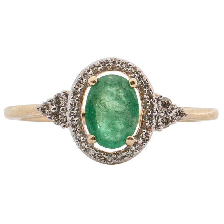 0.3 Carat Emerald and .15 Carat Diamond Ring, 10 Karat Yellow Gold: Item Details: Metal type: 10 Karat Yellow GoldWeight: 2.2 gramsFits Ring Size 7 (resizable) Diamond Detail:Cut: RoundCarat: .15 CaratColor: HClarity: SIEmerald Details:Cut: Oval Carat: .3 CaratsColor: