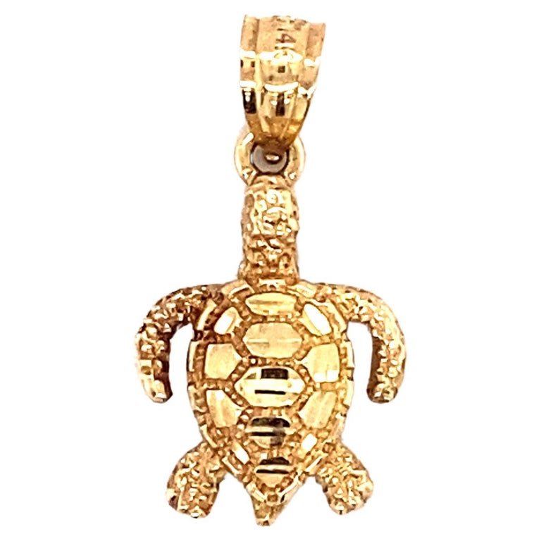 Sea Turtle Charm in 14 Karat Gold: Circa: 1980Metal Type: 14 karat yellow gold Weight: 1.2 gramsDimensions: 22.7mm length including bail