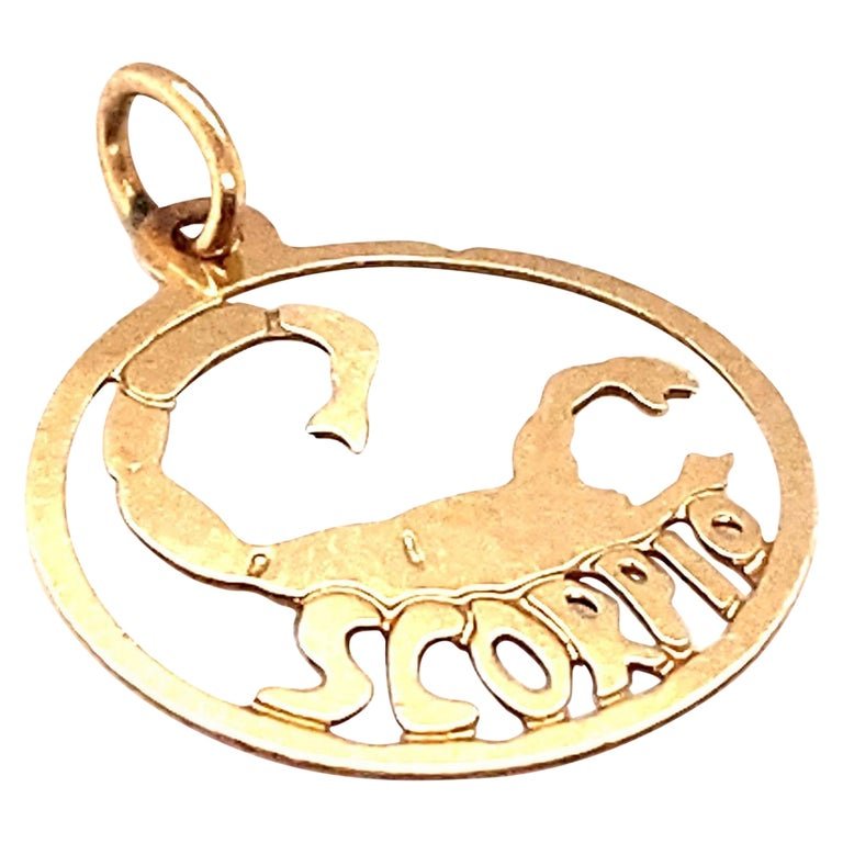 Zodiac Scorpio Charm in 14 Karat Gold: Circa: 1980Metal Type: 14 karat gold Weight: 0.4 gramsDimensions: 20.9mm length including bail