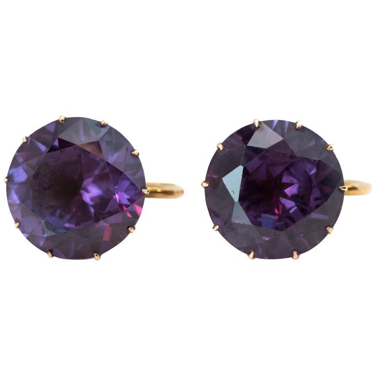 1920s Purple Synthetic Alexandrite Clip on Earrings in 14 Karat Yellow Gold: 1920s Art Deco Round Synthetic Alexandrite Screw Back Clip On Earrings crafted in 14 karat Yellow GoldFeatures:Medium Purple Synthetic Alexandrite 14 karat Yellow Gold SettingScrew Back Clip On design