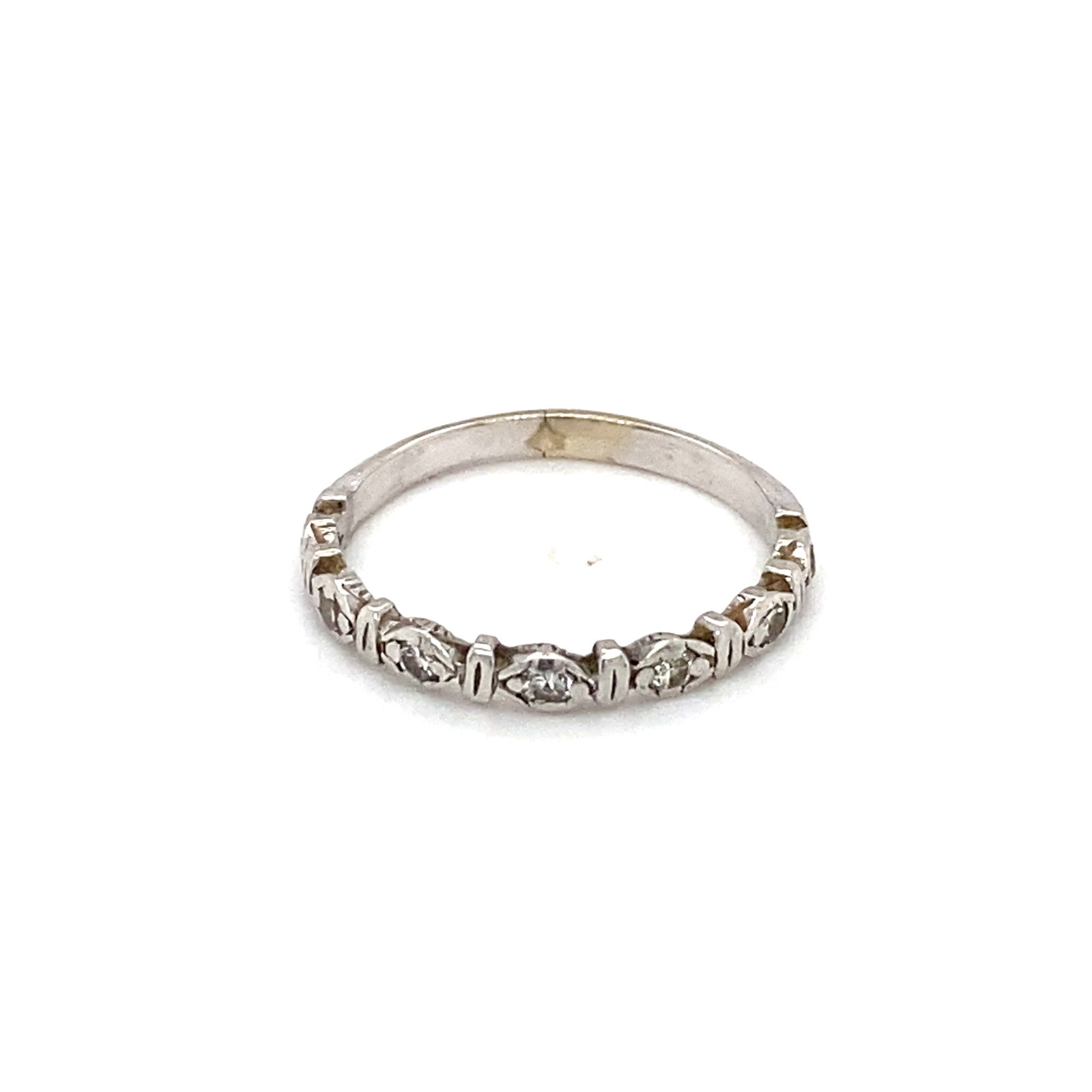 Circa 1920s Diamond Band Ring in 14K White Gold: 14k white gold diamond band, 1920s, with diamonds 0.10ctw. Size 4.25, 1.5g. LA230
