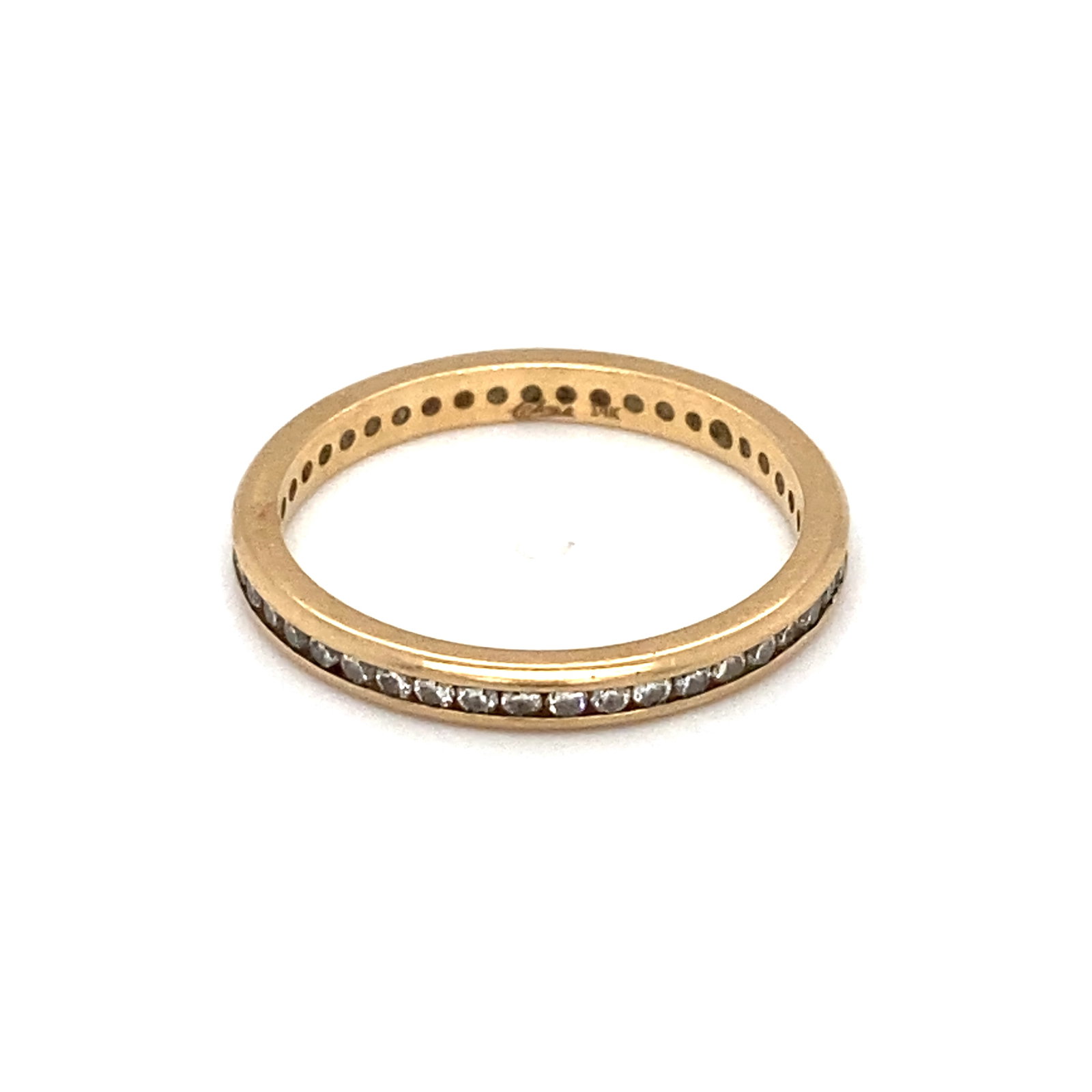 14K Gold Diamond Eternity Band: 14k gold diamond eternity band with diamonds at approximately 0.30ctw. Size 6.75, 1.8g