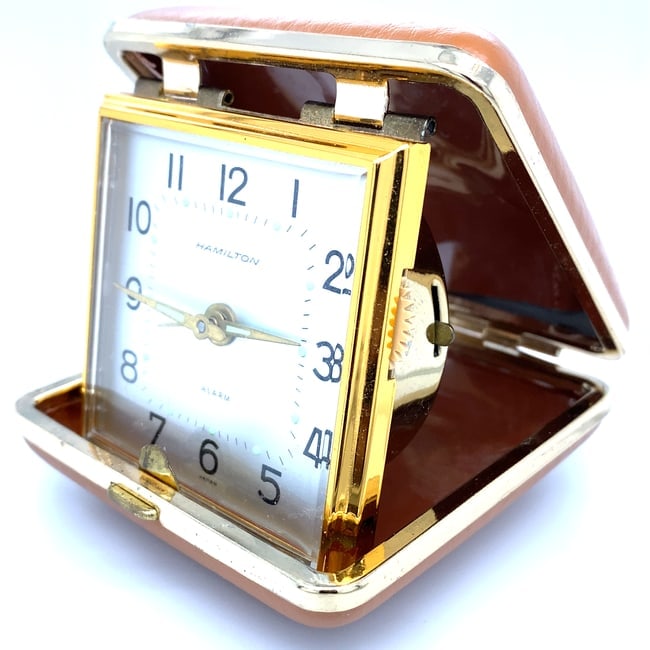 Hamilton Traveler Alarm Clock: Hamilton mid-century traveler alarm clock with case Made in Japan, functionality unknown.