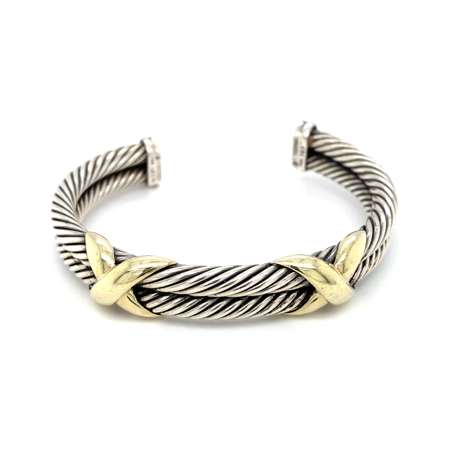 David Yurman Double "X" Bracelet in Sterling silver and 14K Yellow Gold: Brand: David Yurman, Metal type: Sterling Silver and 14K Yellow gold, Other details: 10 mm double "X", Dimensions: 2.25" Width, Weight: 47.8 g