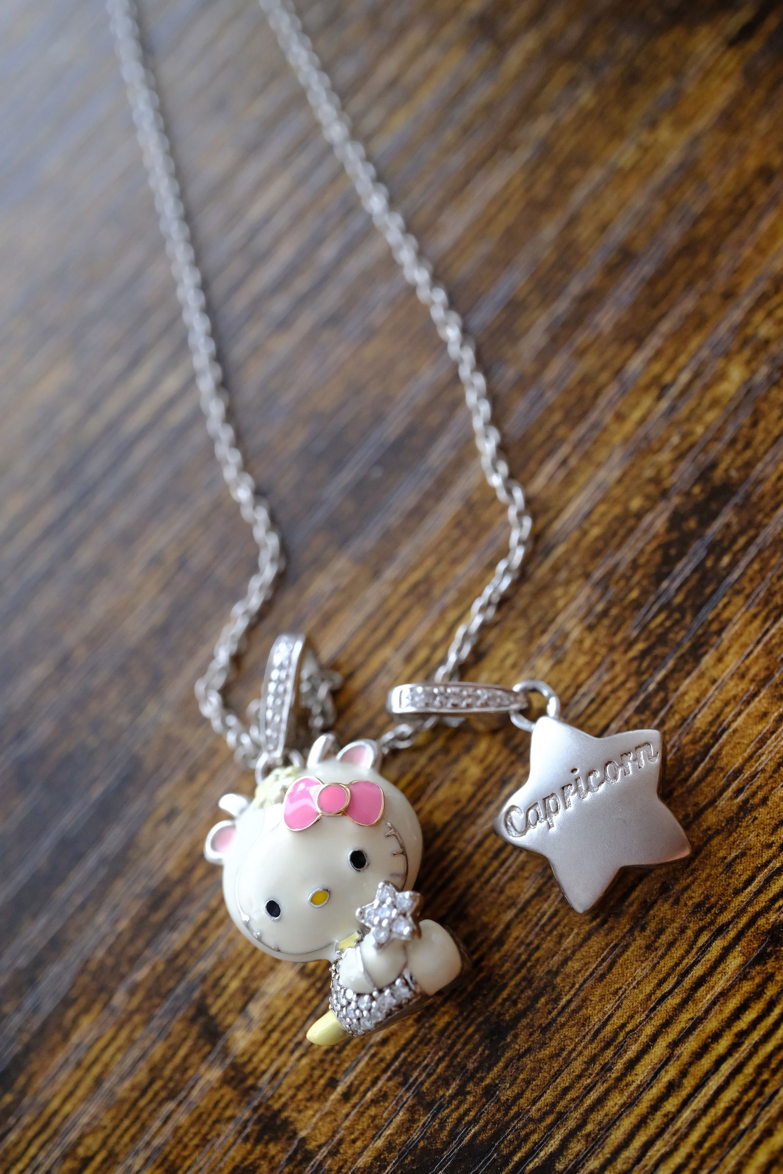 Italian Hello Kitty Capricorn Pendant Necklace in Sterling Silver: Italian Hello Kitty Capricorn pendant necklace in sterling silver, Pendant dimensions: 21 mm length and 16 mm length, Necklace dimensions: 18" length, Weight: 13.8 g