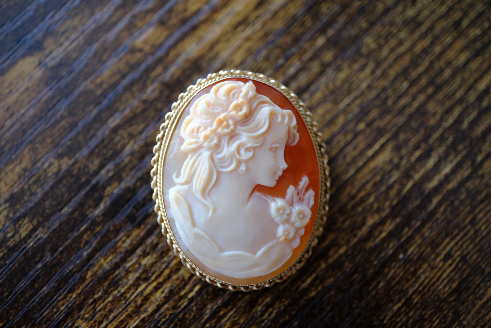 Estate Carved Shell Cameo Brooch/Pendant in 14K Yellow Gold: Era: Estate, Metal type: 14K Yellow Gold, Carved shell cameo, Dimensions: 1.5" height x 1.25" width, Weight: 8.4 g