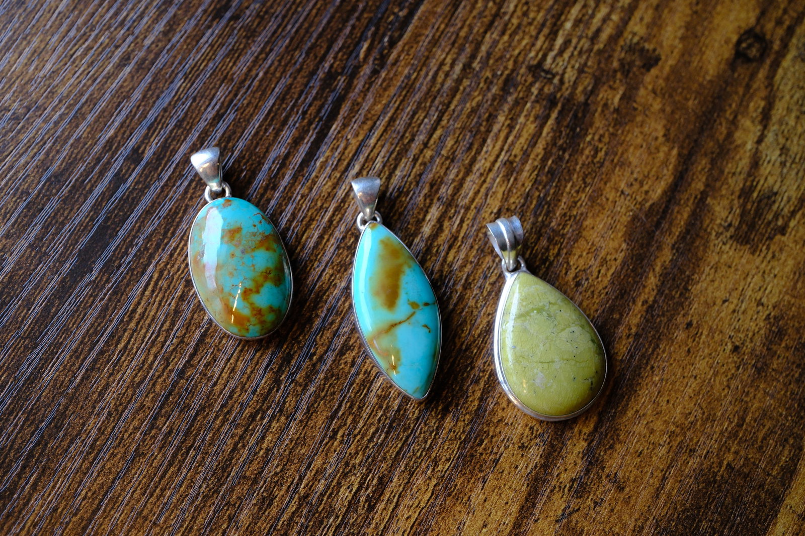 Lot of Three Turquoise Pendants in Sterling Silver: Metal type: Sterling Silver, Stone: Turquoise, Dimensions: 37 mm length, 40 mm length and 43 mm length including bail, total weight: 20.0 g