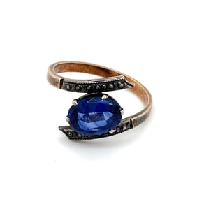 Circa 1910s Edwardian Simulated Sapphire Bypass Ring in 9K Yellow Gold
