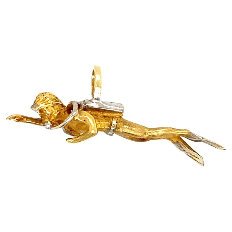 2000s Scuba Diver Pendant in 14 Karat Yellow Gold: Circa 2000s 14 karat yellow and white gold scuba diver pendant or charm, handmade, 1.5"W, 5.6 grams