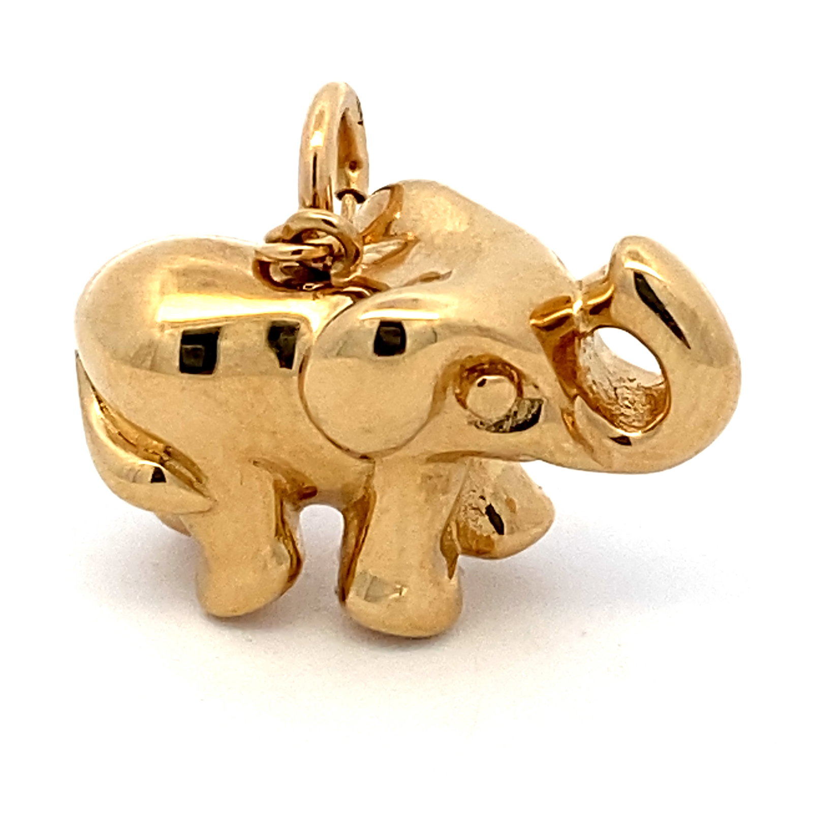 Circa 1980s Elephant Charm in 14 Karat Yellow Gold: Circa 1980, 14 karat yellow gold, weight 1.2 grams, dimensions 20.4mm height including bail