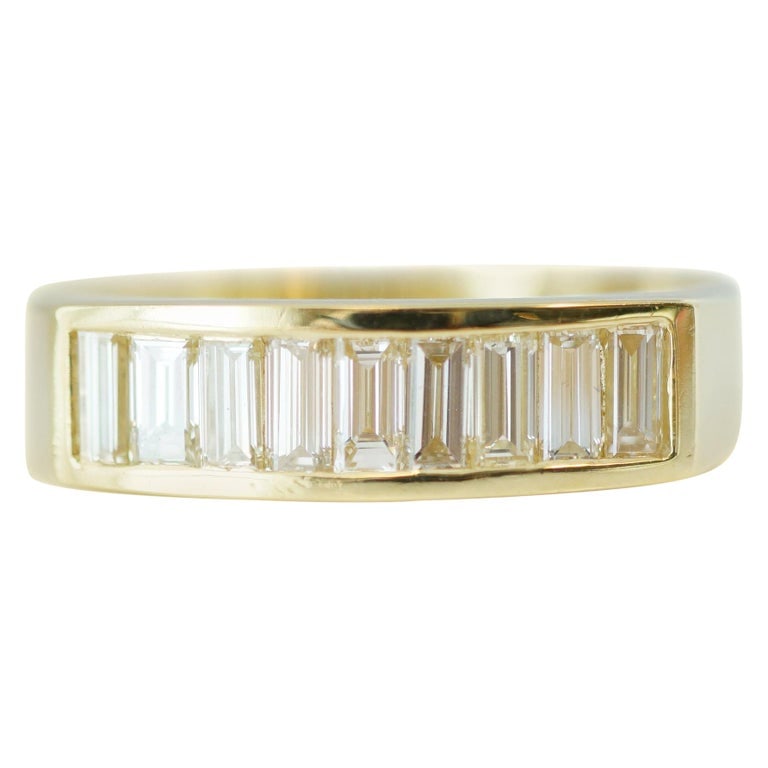 1 Carat Total D Flawless Diamond and 18 Karat Yellow Gold Band Ring: 18 karat yellow gold ring with 1.0 carat total weight of emerald cut diamonds, D color, internally flawless clarity. Size US 10, 6.7 grams.