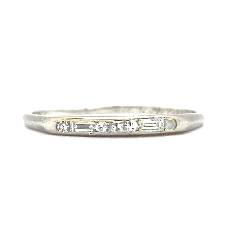 Single Cut and Baguette Diamond Anniversary Band in Platinum: Antique wedding band with single cut and baguette diamonds and is inscribed with a date (unintelligible), made in platinum. Size US 8, 1.9 grams.