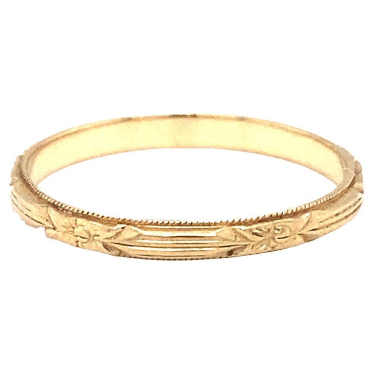 Circa 1920s Art Deco Floral Design Wedding Band in 14 Karat Yellow Gold: Antique wedding band in 14 karat yellow gold with floral design, size US 6, 1.2 grams.