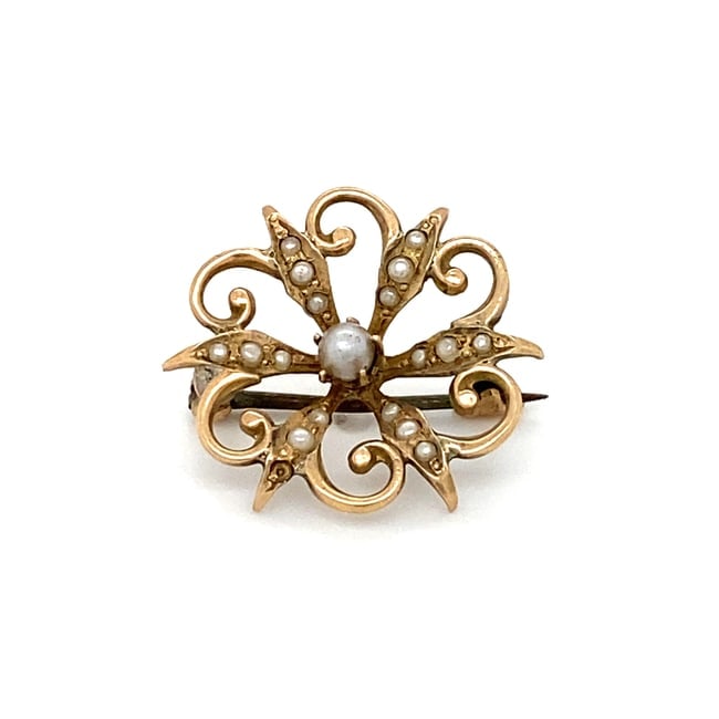 Circa: 1910s Edwardian Seed Pearl Pin in 10K Yellow Gold: Circa: 1910, Style: Edwardian, Gemstone: Seed Pearl, Important: One missing pearl, Dimensions: 0.75 " Diameter, Weight: 1.6 g