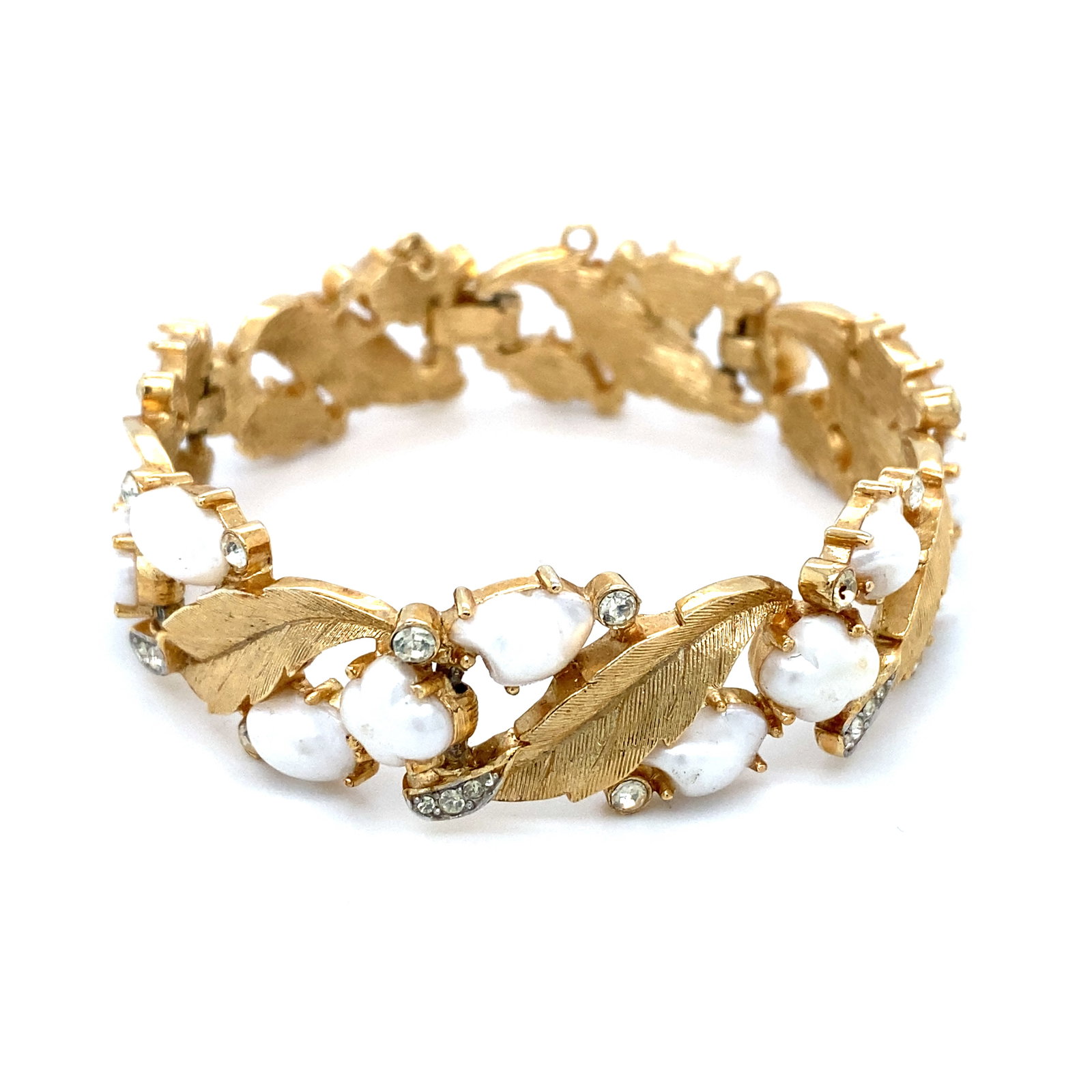 Vintage Trifari Faux Pearl and Rhinestone Leaf Bracelet in Gold tone: Brand: Trifari, Metal type: Gold Tone, Stones: Faux pearl and rhinestone, Dimensions: 7" Length, Weight: 34.7 g