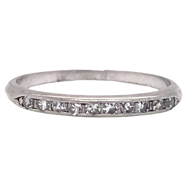 Circa 1920s Diamond Anniversary Band in Platinum: Circa 1920s platinum anniversary, with accent round diamonds. Size US 4.5, 1.8 grams.