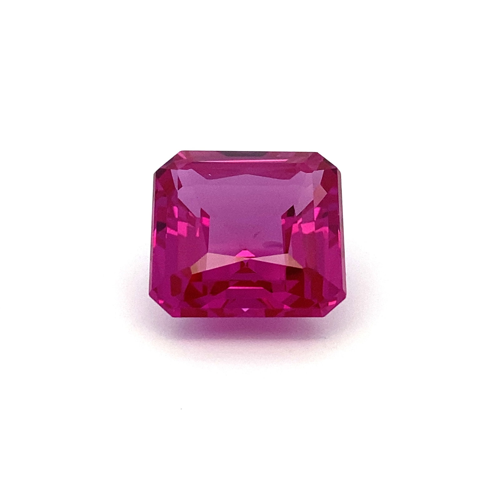 Synthetic Pink Sapphire: Synthetic pink sapphire, measures 17x17mm and weighs 31 carats.