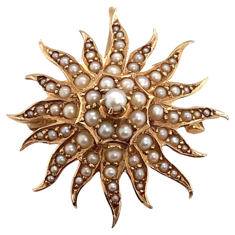 Circa 1890s Birks London Canada Sunburst Seed Pearl Brooch in 15 Karat Gold: Circa 1890, 15k yellow gold sunburst pin with seed pearls by Birks of London, Canada. Can also be worn as a pendant, weight 6.1 grams, dimensions 1" diameter