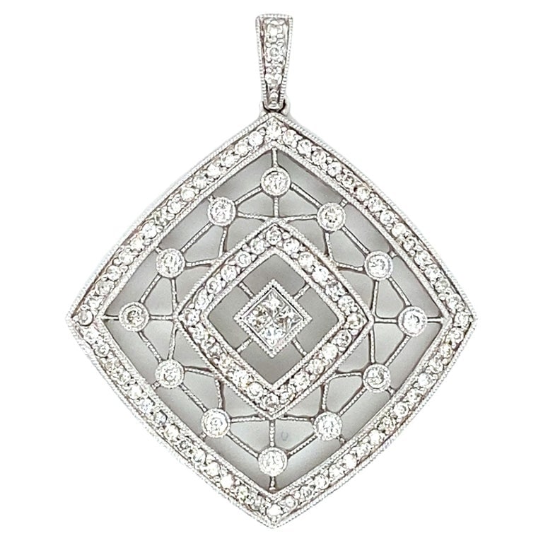 2000s Square Filigree Diamond Pendant in 18 Karat White Gold: Circa: 2000s,Metal Type: 18 karat white gold, Weight: 5.4 grams, Size: 1.5 inch, Diamond Details: Carat: 0.50 carat total weight (Approximately), Shape: Round